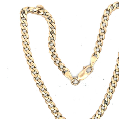 9ct yellow gold curb bracelet weighing 5.2g, featuring a classic chain design with polished links.