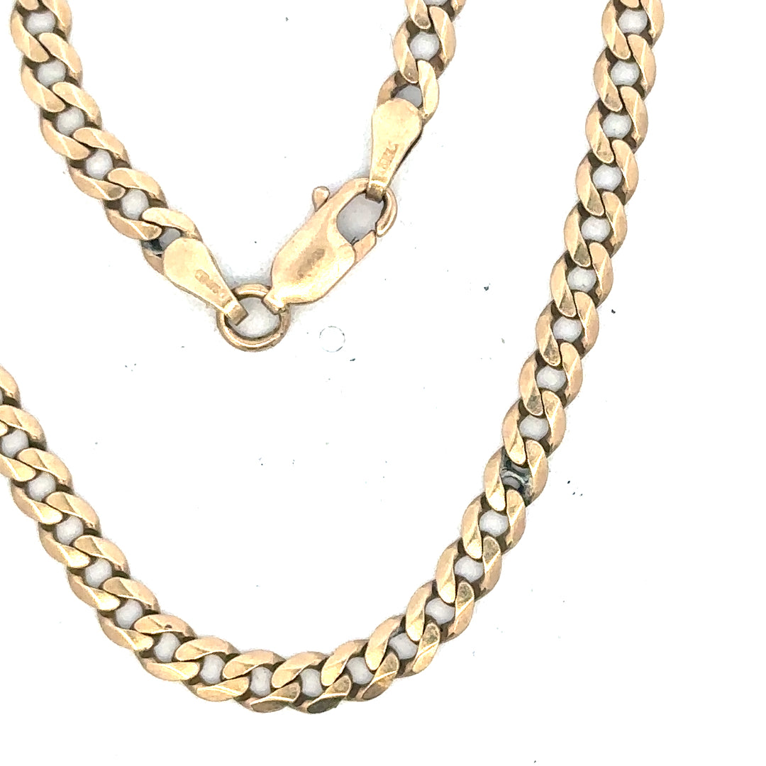 9ct yellow gold curb bracelet weighing 5.2g, unbranded, showcasing a classic gold chain design on a plain background.