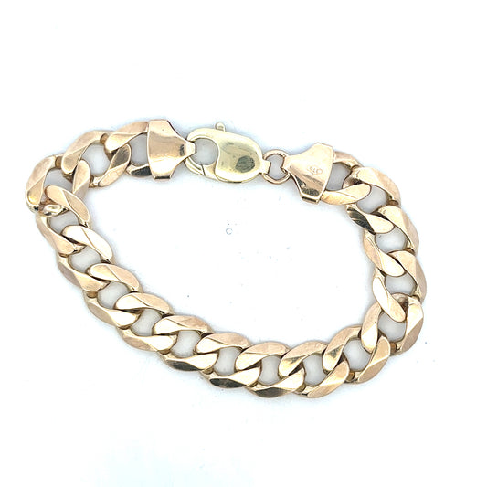 9ct yellow gold curb bracelet with a polished finish, weight 52.6g, showcasing a classic chain design.