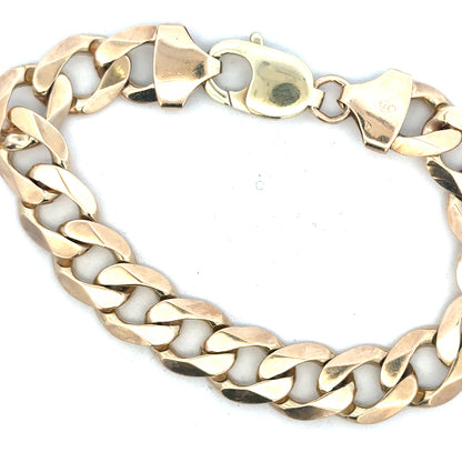 9ct yellow gold curb bracelet with a bold chain design, weighing 52.6g, featuring a classic unbranded jewelry style.