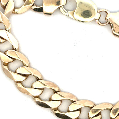 9ct yellow gold curb bracelet, unbranded, with a weight of 52.6g, featuring classic gold link design.