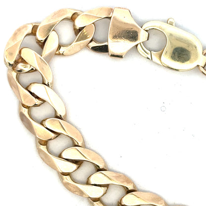 9ct yellow gold curb bracelet, unbranded, with a weight of 52.6g, showcased on a plain background.
