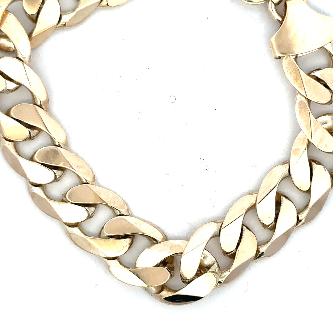 9ct yellow gold curb bracelet weighing 55g, featuring a classic chain design, shown in a detailed close-up image.