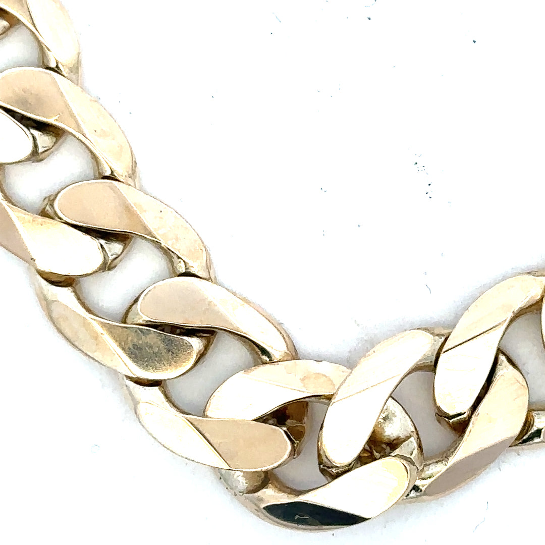9ct yellow gold curb bracelet with a 55g weight, featuring a classic chain design and secure clasp.