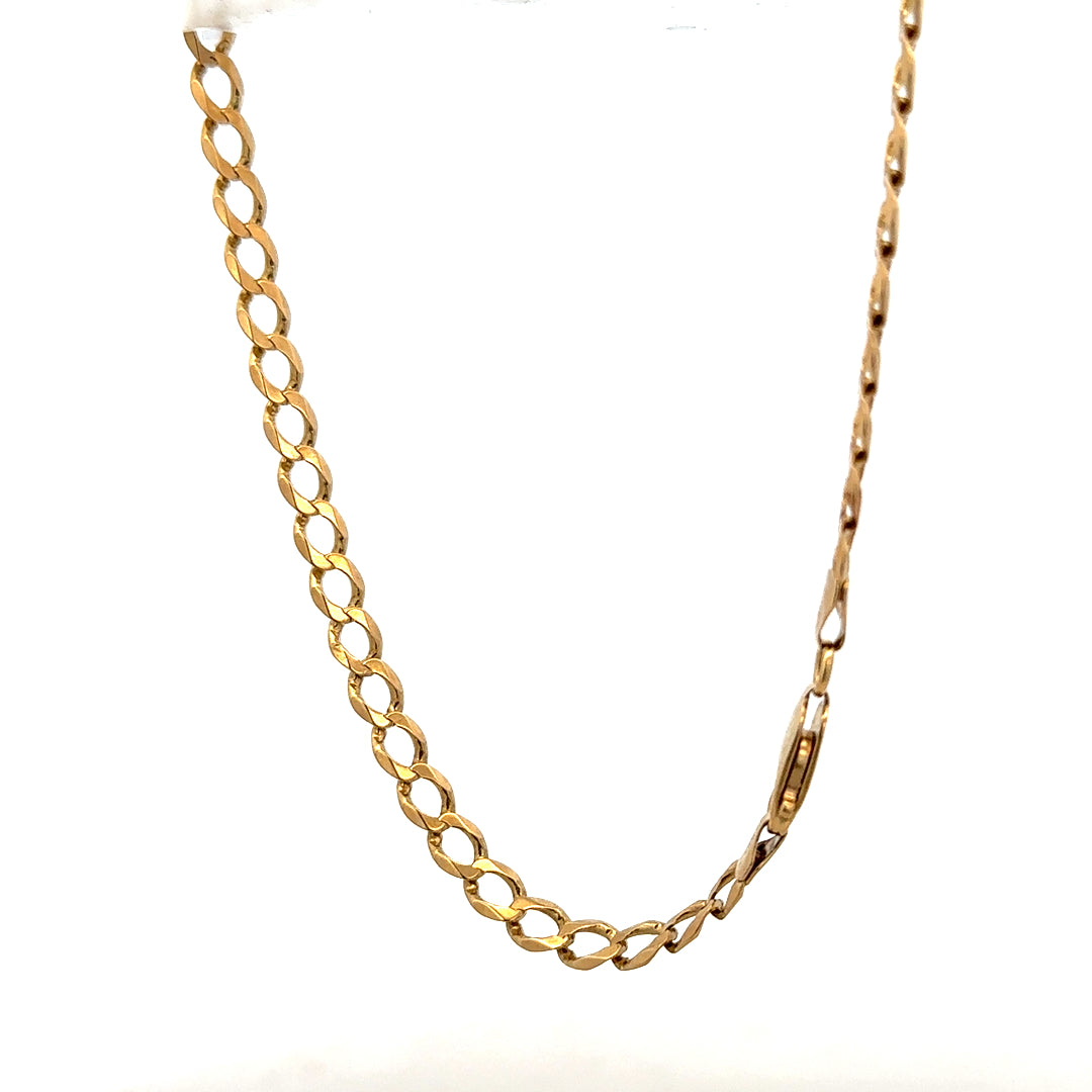 9ct yellow gold curb bracelet weighing 7.6g, featuring a classic linked chain design, suitable for everyday wear.