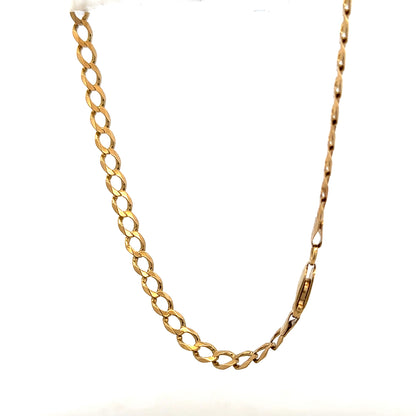 9ct yellow gold curb bracelet weighing 7.6g, featuring a classic linked chain design, suitable for everyday wear.