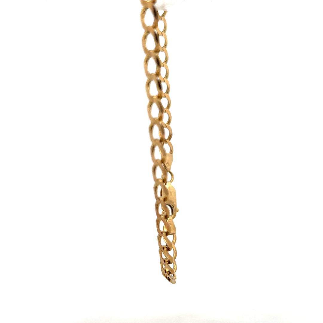9ct yellow gold curb bracelet weighing 7.6g, featuring classic linked chain design and secure clasp, unbranded jewelry accessory.