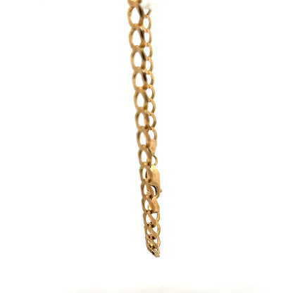 9ct yellow gold curb bracelet weighing 7.6g, featuring classic linked chain design and secure clasp, unbranded jewelry accessory.