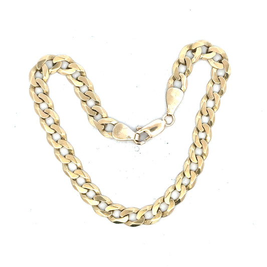 9ct yellow gold curb bracelet weighing 8.3g, featuring classic linked chain design, unbranded jewelry accessory.