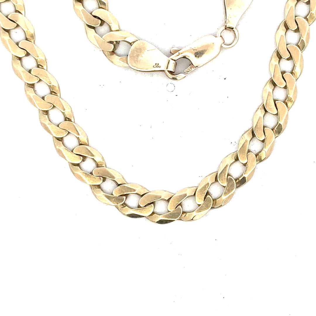 9ct yellow gold curb bracelet weighing 8.3g, featuring classic chain links and a polished finish.