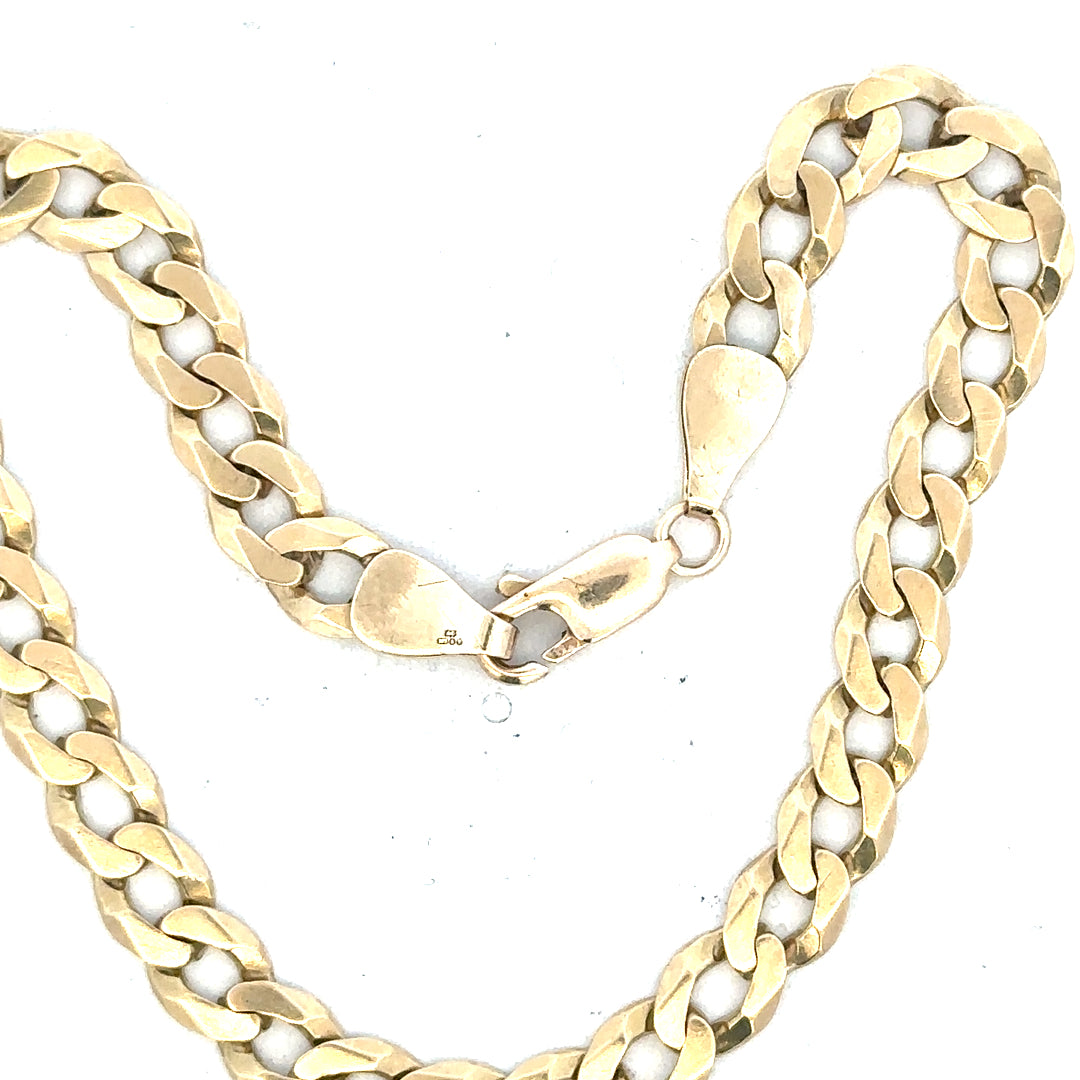 9ct yellow gold curb bracelet weighing 8.3g, showcasing a classic linked chain design with a polished finish.