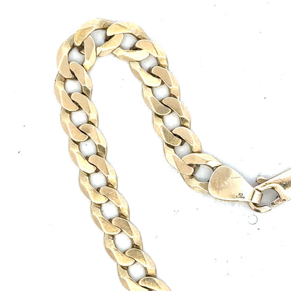 9ct yellow gold curb bracelet weighing 8.3g, featuring classic link design and polished finish.