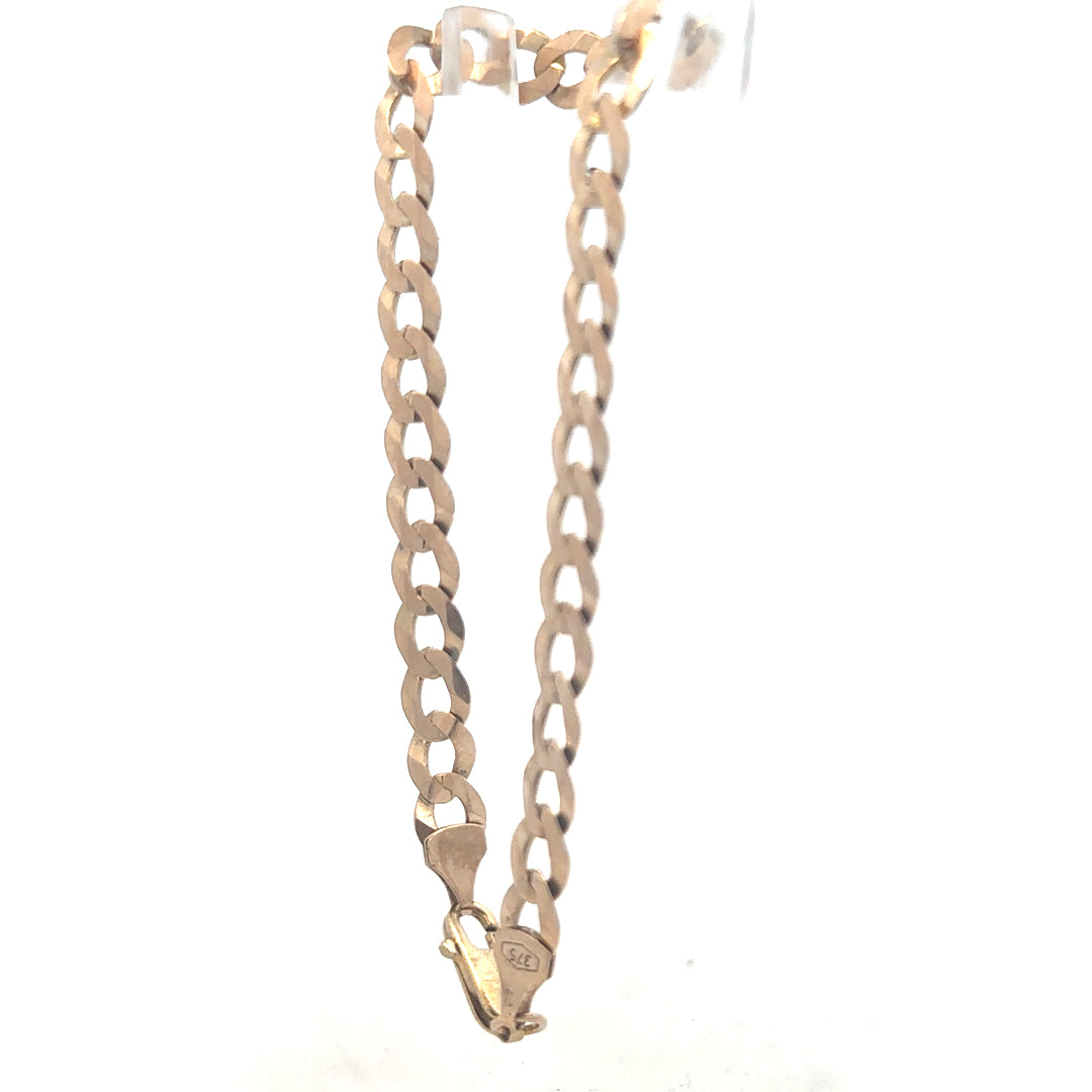 9ct yellow gold curb bracelet weighing 8.5g, featuring classic linked chain design, unbranded jewelry accessory.