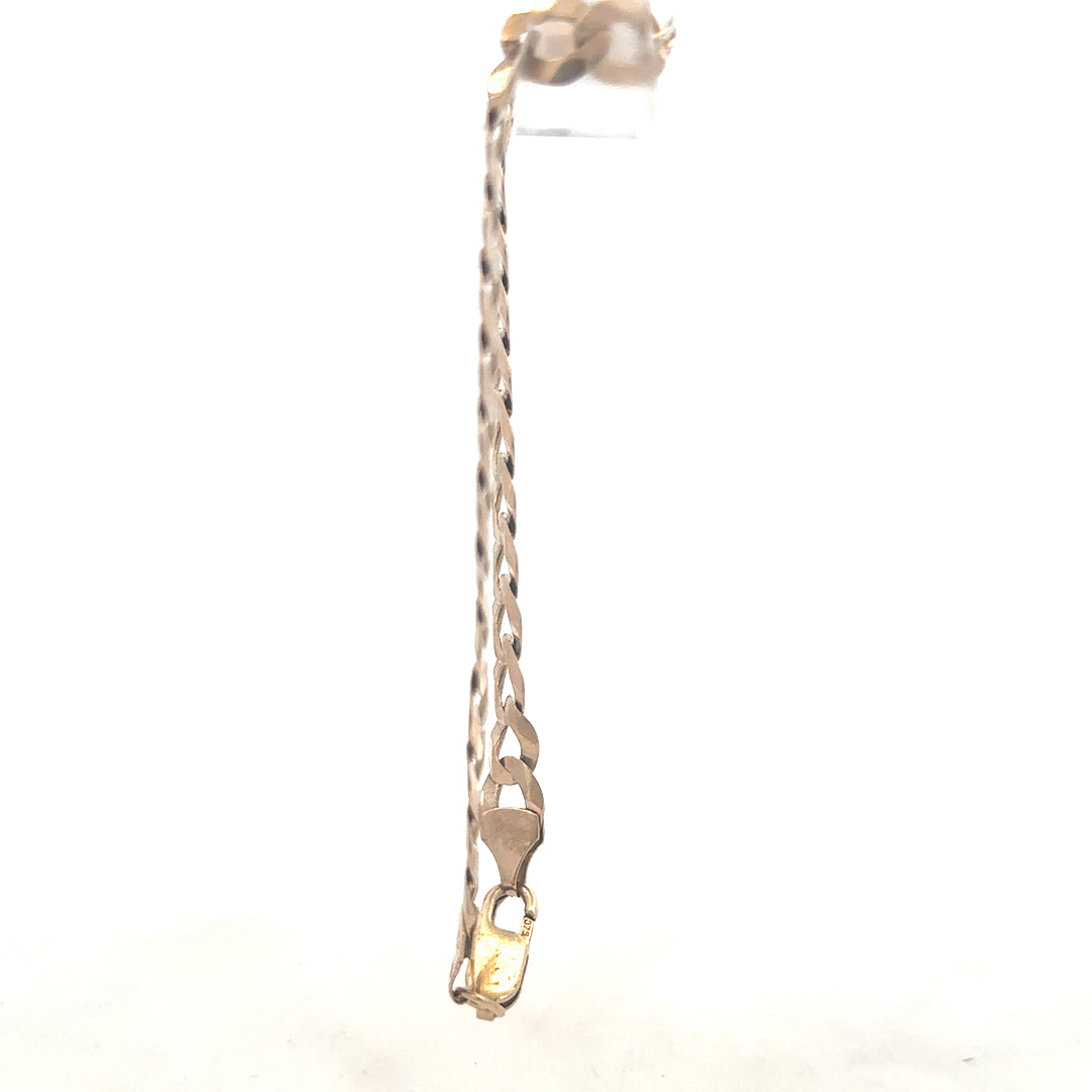 9ct yellow gold curb bracelet weighing 8.5g, featuring classic linked chain design, unbranded jewelry accessory.