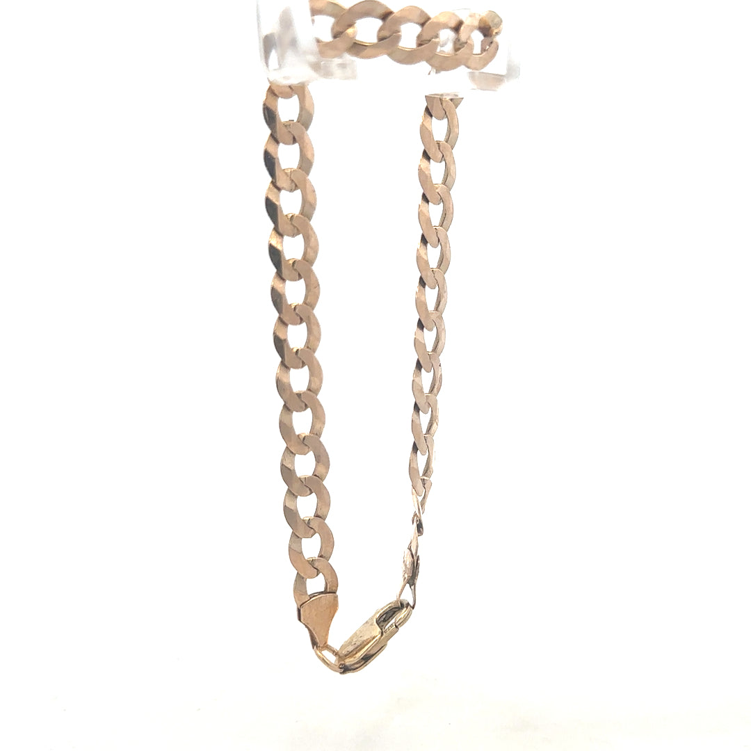 9ct yellow gold curb bracelet weighing 8.5g, unbranded, with a classic link design, displayed on a neutral background.