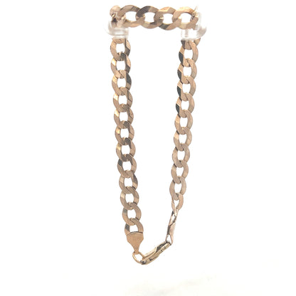 9ct yellow gold curb bracelet weighing 8.5g with a classic chain design, unbranded jewelry for everyday wear.