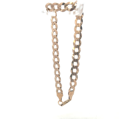 9ct yellow gold curb bracelet weighing 8.5g, featuring classic linked design and secure clasp, unbranded jewelry accessory.