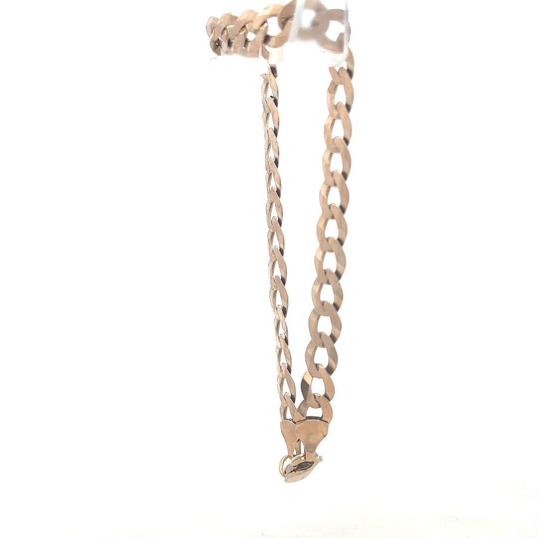 9ct yellow gold curb bracelet weighing 8.5g, unbranded, with a classic chain design and secure clasp, displayed on a neutral background.