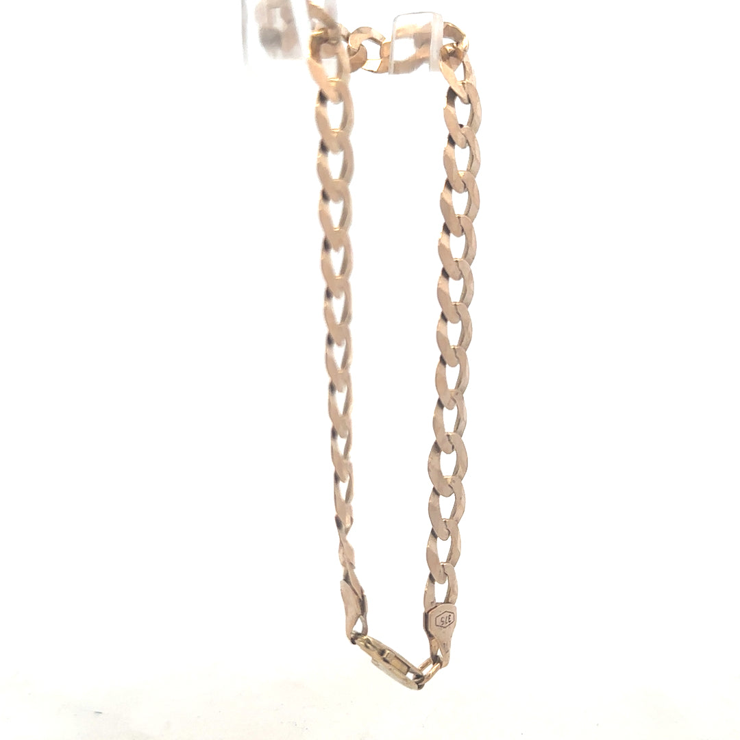 9ct yellow gold curb bracelet weighing 8.5g, featuring classic link design, unbranded jewelry piece with polished finish.