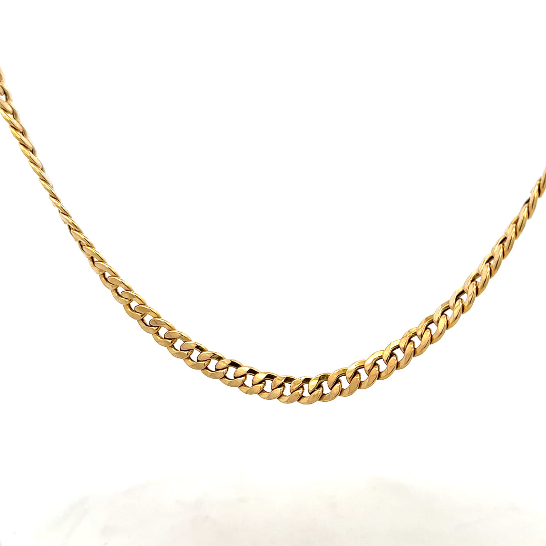 9ct yellow gold curb chain weighing 14.6g, showcasing a classic design with polished links on a plain background.