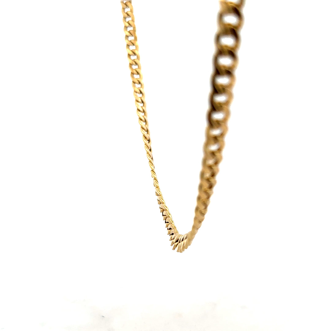 9ct yellow gold curb chain weighing 14.6g, close-up view showing the links and shiny gold finish.