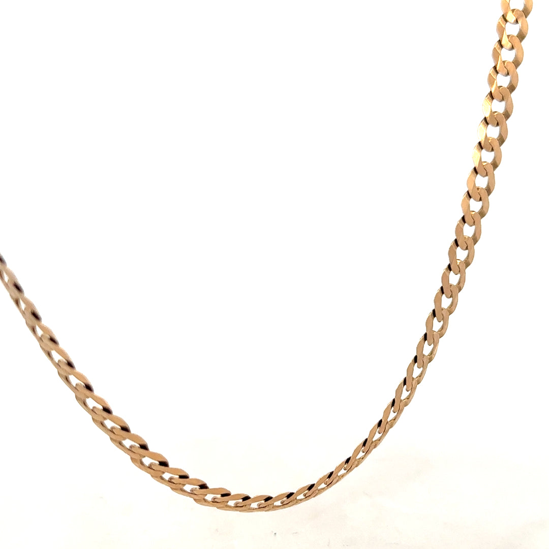 9ct yellow gold curb chain weighing 14.7g, showcasing its detailed links and polished finish.