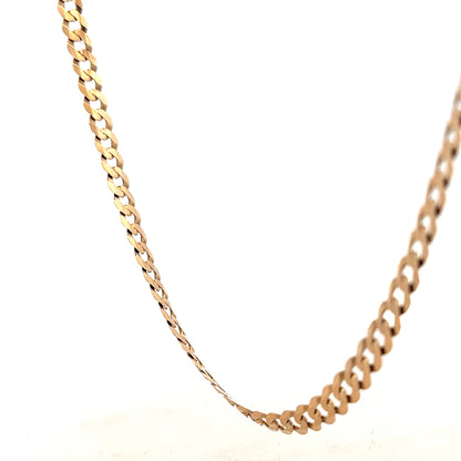 9ct yellow gold curb chain weighing 14.7g, unbranded jewelry with detailed links, close-up view of the gold chain.