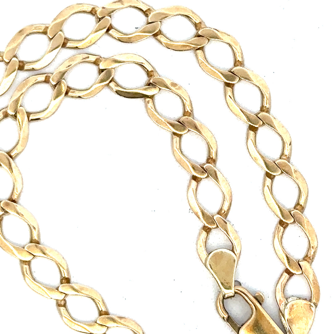 9ct yellow gold curb chain weighing 16.3g, featuring classic linked design and polished finish.