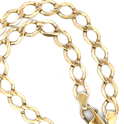 9ct yellow gold curb chain weighing 16.3g, featuring classic linked design and polished finish.