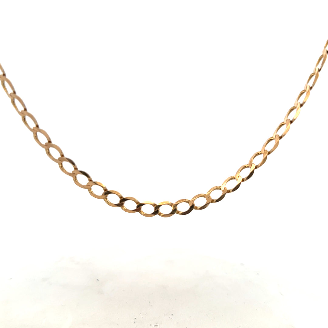 9ct yellow gold curb chain, 17.3g, unbranded, with detailed links, displayed on a neutral background.