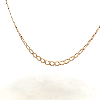 9ct yellow gold curb chain weighing 17.3g, featuring a classic linked design with a secure clasp.