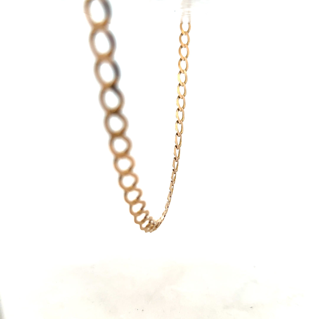 9ct yellow gold curb chain weighing 17.3g, featuring classic linked design, unbranded jewelry accessory.