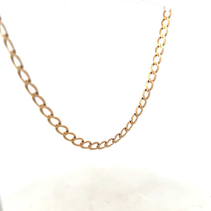 9ct yellow gold curb chain weighing 17.3g, unbranded jewelry with classic link design, shown in close-up detail.