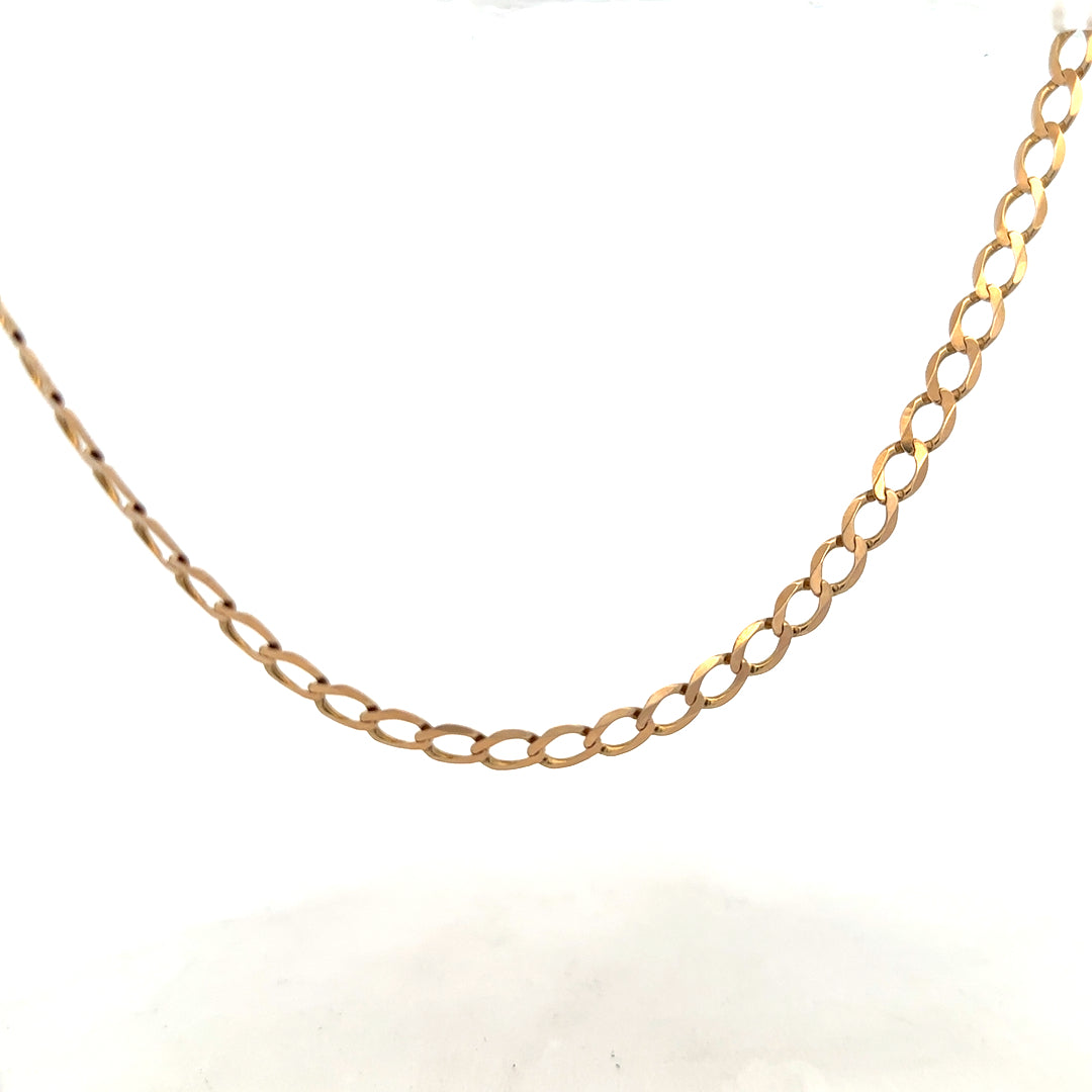 9ct yellow gold curb chain weighing 17.3g, featuring a classic linked design, displayed on a neutral background.