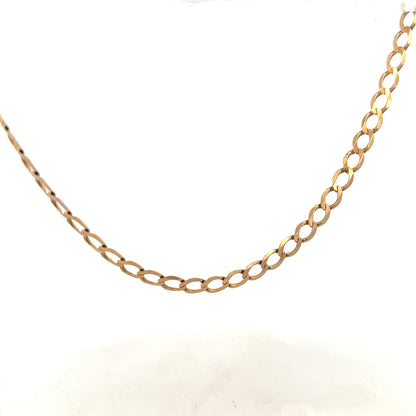 9ct yellow gold curb chain weighing 17.3g, featuring a classic linked design, displayed on a neutral background.
