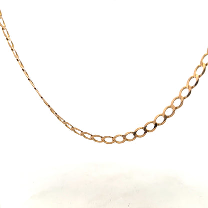 9ct yellow gold curb chain weighing 17.3g, featuring classic links and a polished finish, displayed on a plain background.