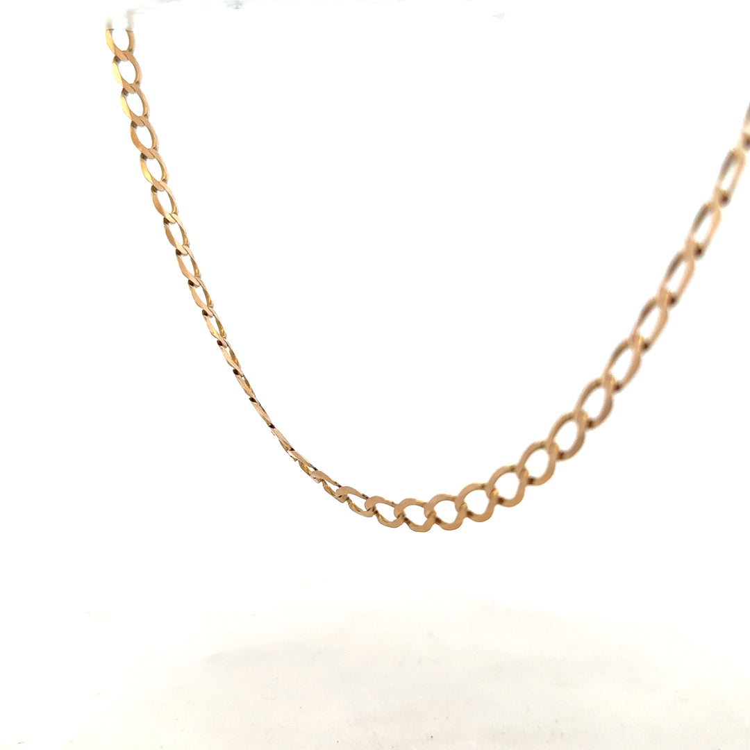 9ct yellow gold curb chain weighing 17.3g, featuring tightly linked, polished gold links for a classic jewelry look.