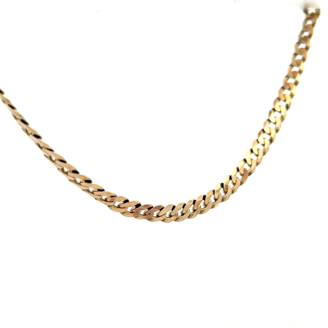 9ct yellow gold curb chain weighing 25.4g, unbranded jewelry chain with polished links, shown on a plain background.