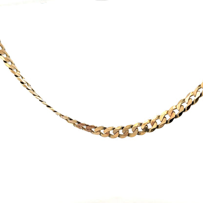 Unbranded 9ct yellow gold curb chain weighing 25.4g with a classic interlocking link design.