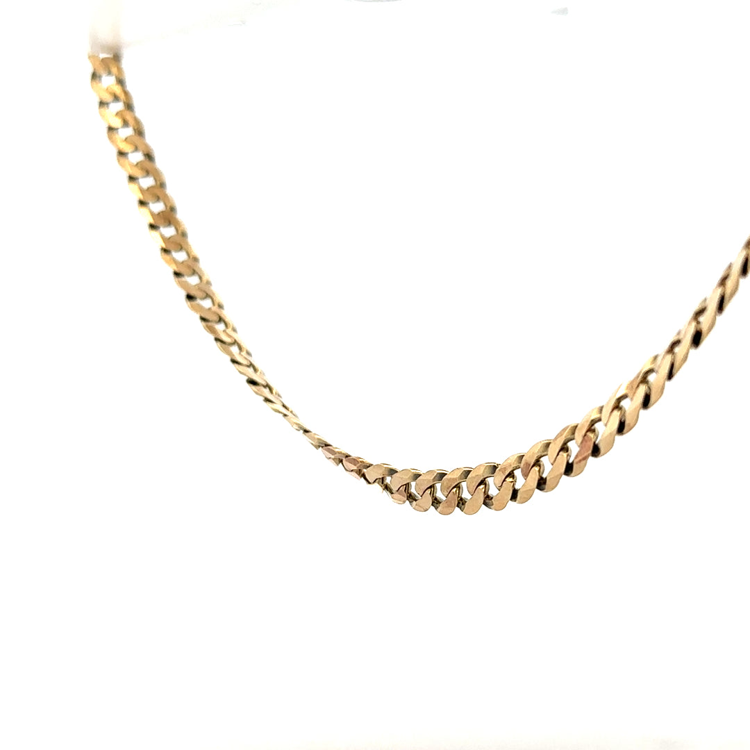 9ct yellow gold curb chain, unbranded, weighing 25.4g, with a detailed close-up of the chain links and polished finish.