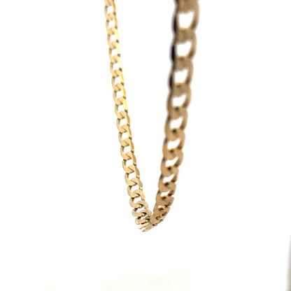 9ct yellow gold curb chain weighing 30.3g, featuring a classic design and polished finish, ideal for everyday wear.