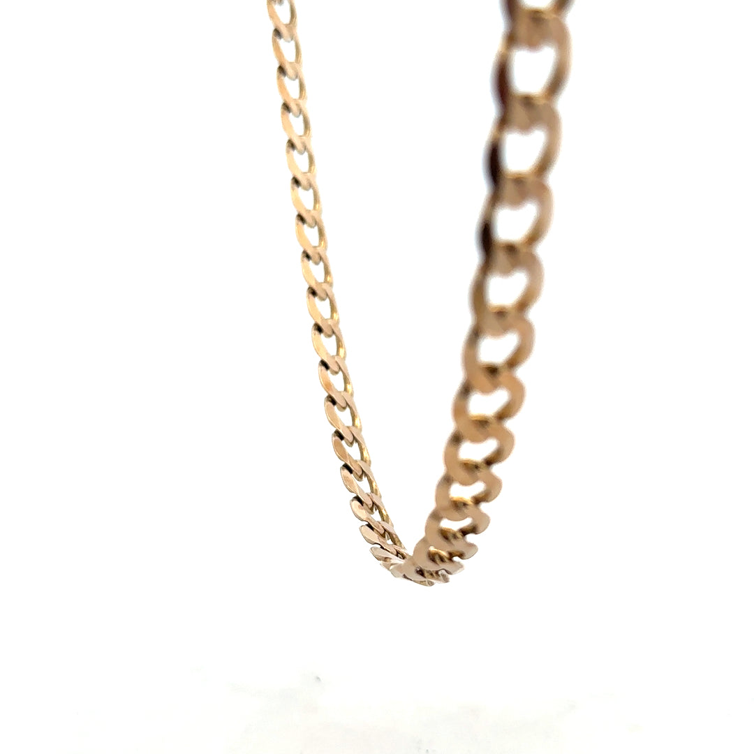 9ct yellow gold curb chain weighing 38.8g, featuring classic linked design and polished finish.