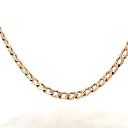9ct yellow gold curb chain weighing 38.8g, unbranded jewelry with a classic design and polished finish.