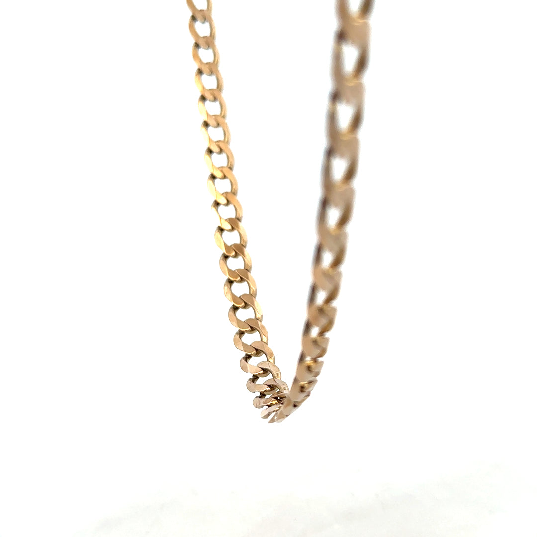 9ct yellow gold curb chain weighing 38.8g, showcasing a classic design with polished links, unbranded jewelry piece.