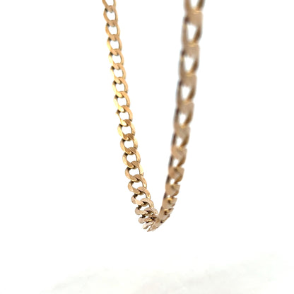 9ct yellow gold curb chain weighing 38.8g, showcasing a classic design with polished links, unbranded jewelry piece.