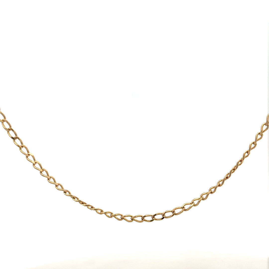 9ct yellow gold curb chain weighing 5.9g with a classic link design, unbranded jewelry accessory.