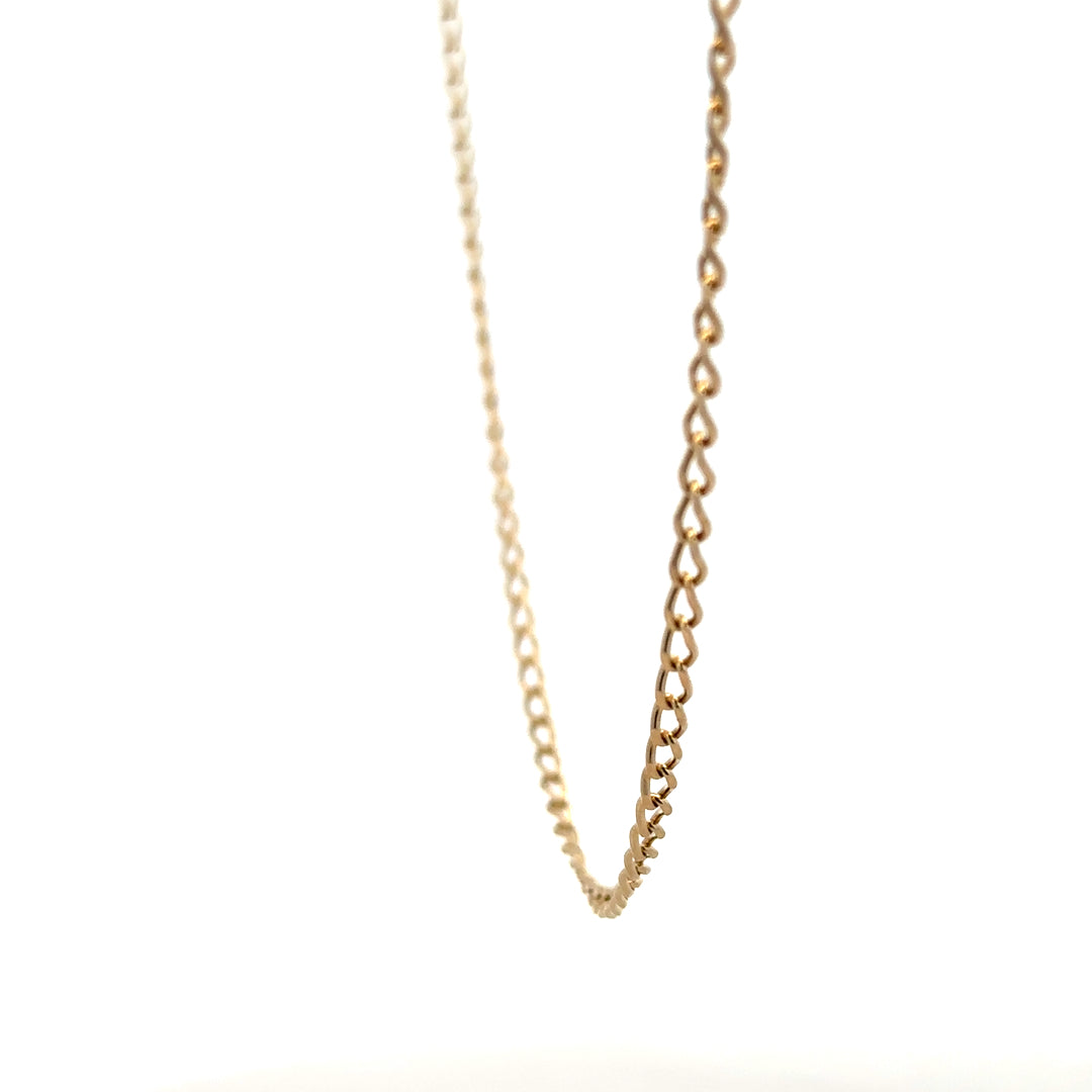 9ct yellow gold curb chain weighing 5.9g, displayed on a plain background with a close-up view of the chain links.