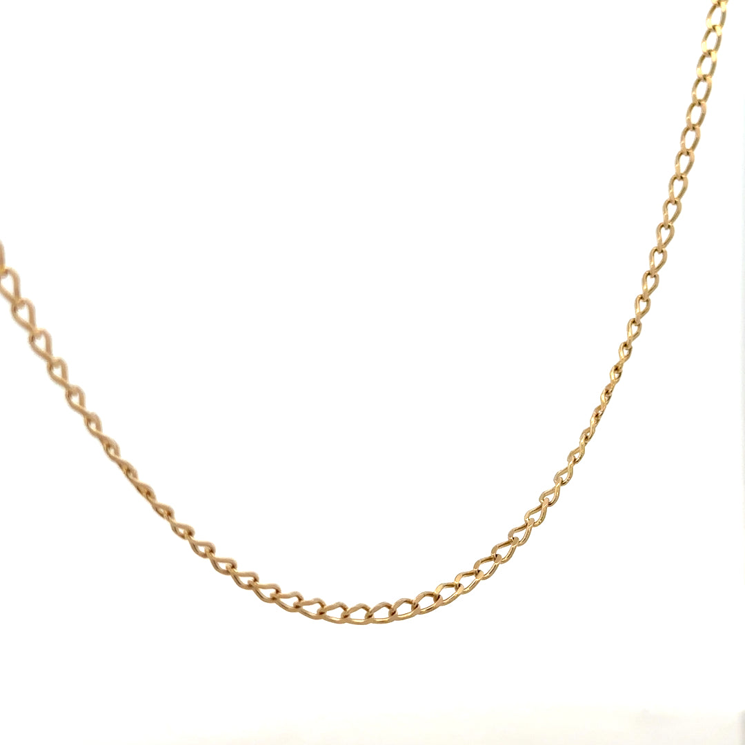 9ct yellow gold curb chain weighing 5.9g, unbranded jewelry with classic curb link design, displayed against a neutral background.
