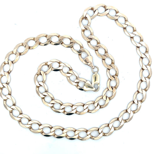 9ct yellow gold curb chain weighing 53.9g, unbranded jewelry with a classic link design, shown in close-up.