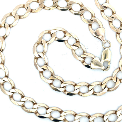 9ct yellow gold curb chain weighing 53.9g, showing a close-up of its textured, interlinked design and polished finish.